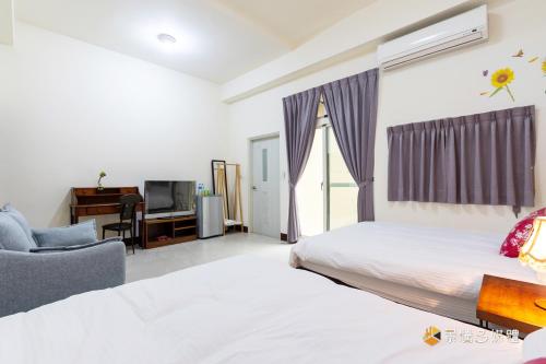 Postel nebo postele na pokoji v ubytování Shi Mom B&B