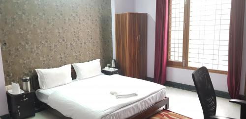 Katil atau katil-katil dalam bilik di Angel NRI House