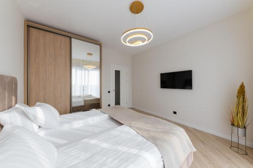 Ένα ή περισσότερα κρεβάτια σε δωμάτιο στο MM GROUP APARTMENT GOLD