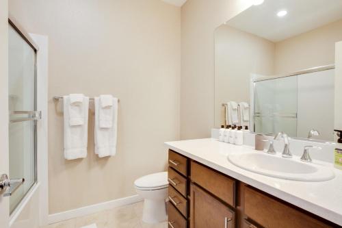 a white bathroom with a sink and a toilet at Milpitas 1br w ac nr movies mall dining SFO-1639 in Milpitas