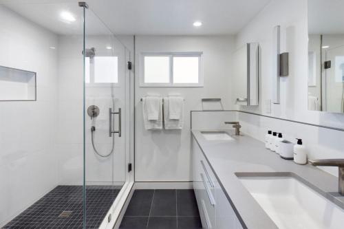 a white bathroom with two sinks and a shower at Cupertino 3br w patio backyard nr restaurants SFO-1636 in Cupertino