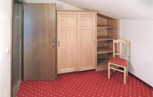 a room with a closet and a chair and a shelf at Amazing Apartment In Flachau With 2 Bedrooms And Internet in Flachau