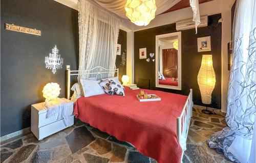 a bedroom with a bed with a red blanket at Nice Home In Ypati Lamia With Wi-fi in Ipáti