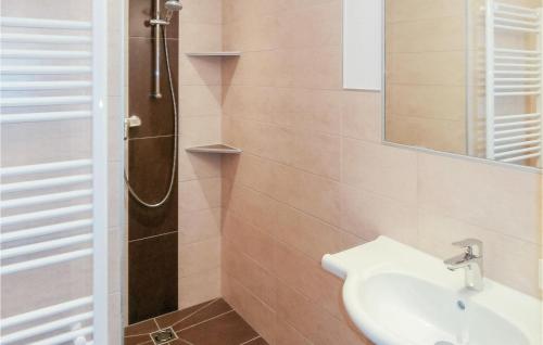 a bathroom with a sink and a shower at Beautiful Apartment In Wagrain With 2 Bedrooms And Internet in Wagrain