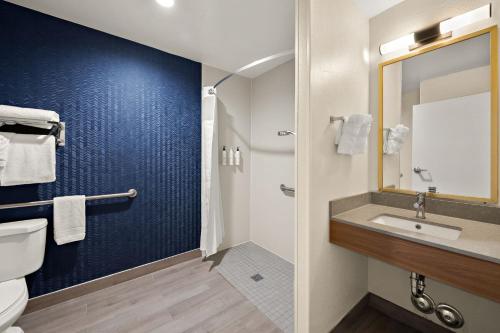 a bathroom with a toilet and a sink at Fairfield by Marriott Chesapeake in Chesapeake