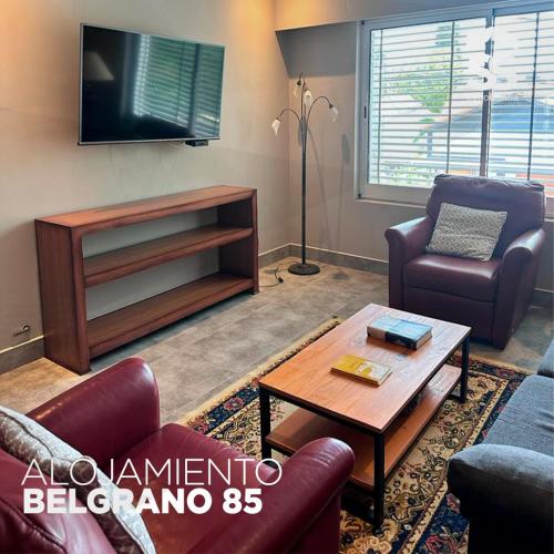 a living room with couches and a coffee table at BELGRANO 85 in Libertador San Martín