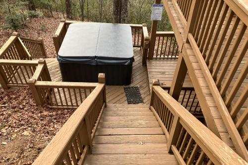 a mattress is laying on a wooden bridge at Sunset Peak in Cherry Log