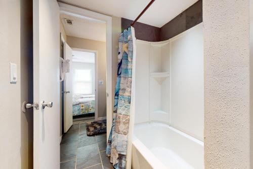 a bathroom with a tub and a shower at Paradise Dream Vacations #2 in Indialantic