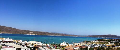 a large body of water with a town and a harbor at Alacati Eldoris Butik Hotel in Alacati