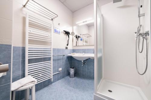 a bathroom with a sink and a shower at Hotel all'Orso in Biancade