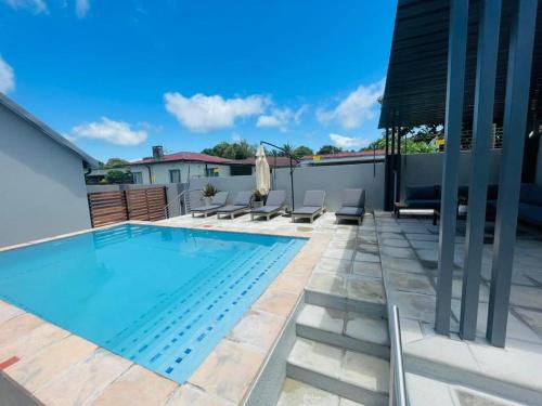 a swimming pool on the roof of a house at Panorama Villa in Graskop