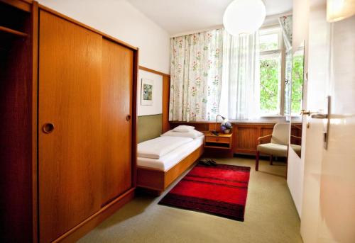En eller flere senge i et værelse på Pension Margit