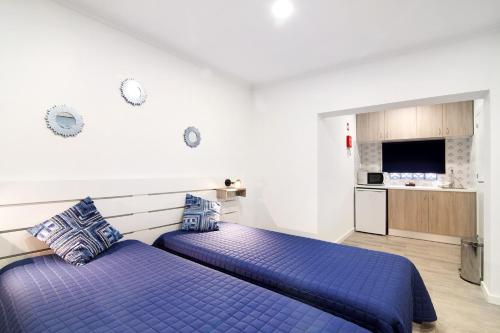 Ένα ή περισσότερα κρεβάτια σε δωμάτιο στο Apartamento Beach