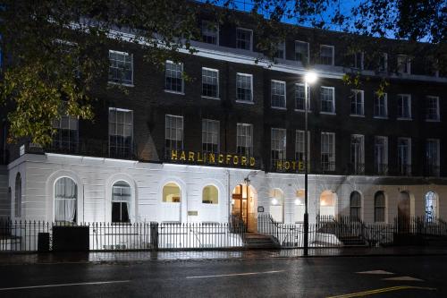 a large white building with a sign on it at Harlingford Hotel in London