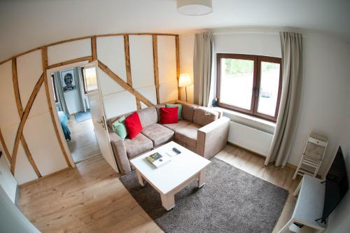 a living room with a couch and a table at The Ring Inn in Adenau