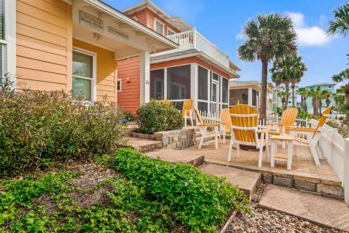 a house with chairs and a table on a porch at Friday Life in Port Aransas