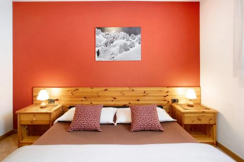 Säng eller sängar i ett rum på Chalet Primula 9