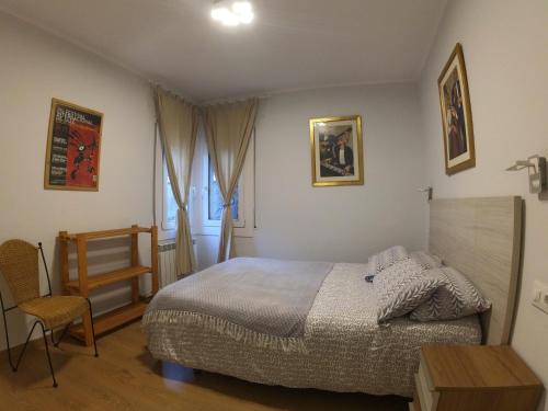 a bedroom with a bed and a table and a chair at Soldeu Paradis Soldeu in Soldeu