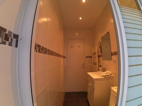 a bathroom with a sink and a mirror at Soldeu Paradis Soldeu in Soldeu