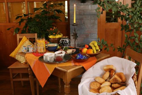 a table with a bunch of food on it at Landgut Stetter in Schöllnach