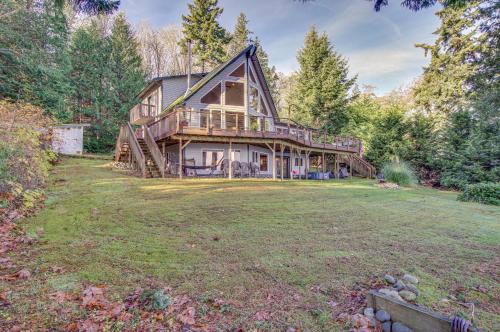 a large house with a large yard at Hat Island Home with Stunning View and Wraparound Deck in Everett
