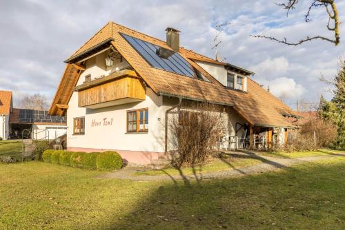 a house with a roof that has a lot of windows at Ferienhaus Toni in Hohenstein