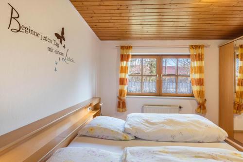 a bedroom with two beds and a window at Ferienhaus Toni in Hohenstein