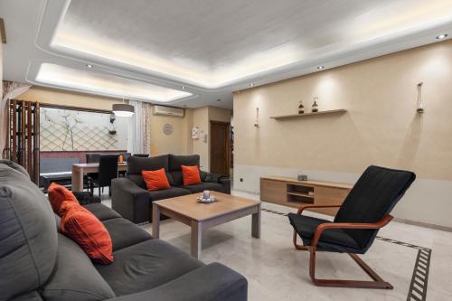 a living room with a couch and a table at Villa Soler House in Malaga by Costarentals - MAL03 in Málaga
