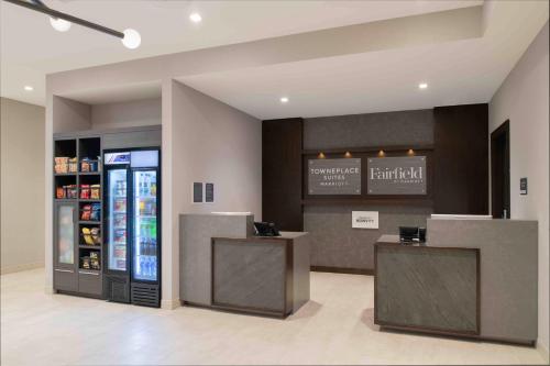 a drink station with a refrigerator in a store at TownePlace Suites by Marriott Framingham in Framingham