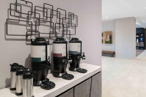 a group of coffee machines sitting on a counter at TownePlace Suites by Marriott Framingham in Framingham