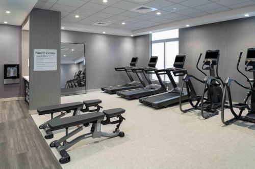 a gym with several treadmills and exercise bikes at TownePlace Suites by Marriott Framingham in Framingham