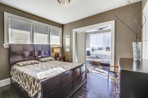 a bedroom with a bed and a living room at Cozy Cincinnati Vacation Rental, Walk to Park! in Cincinnati
