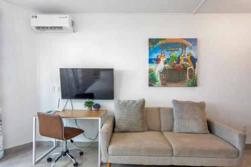a living room with a couch and a table at The Best Little Beach Bar Condo next to The Morgan Village in Maho Reef