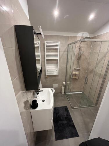a bathroom with a sink and a shower at Marina in Sesvete