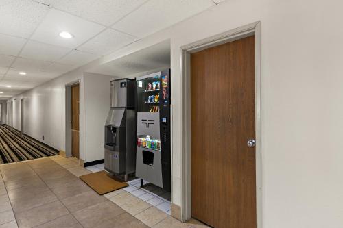 a hallway with a vending machine and a refrigerator at Red Lion Inn & Suites Gretna - Omaha SW in Gretna