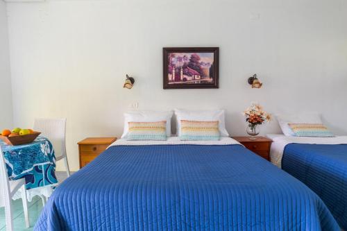 Ένα ή περισσότερα κρεβάτια σε δωμάτιο στο Honu Nui