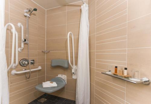 a bathroom with a toilet and a shower stall at Leopold Hotel in Sheffield