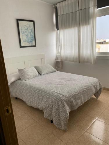 a bedroom with a bed in a room with a window at Room Sol Vecindario Gran Canaria Free parking in Vecindario