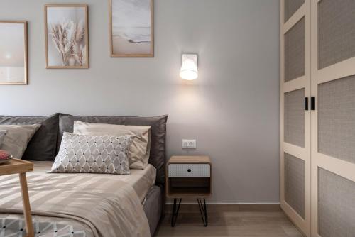 a bedroom with a bed and a table with a lamp at Costa Deluxe in Funtana