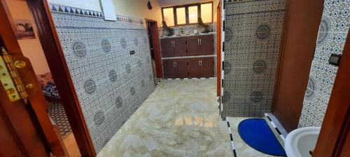 a bathroom with a shower and a sink and a toilet at Dar Salam in Dakhla