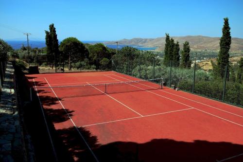 a tennis court with a net on top of it at Villa Mahé Tennis Karystos island EVIA in Karistos