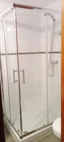 a bathroom with a glass shower with a toilet at Apartamento Happyness Complex Amaya Fuerteventura in Costa de Antigua