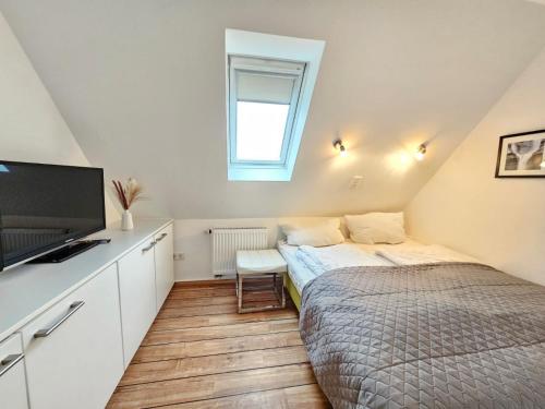 Giường trong phòng chung tại Mienhus Apartments Ferienwohnung Palle