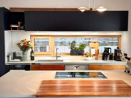 a kitchen with a sink and a counter top at Das Rizzi in Grössing