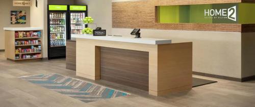 a store lobby with a counter in a store at Home2 Suites By Hilton Fredericksburg South Spotsylvania, Va in Fredericksburg