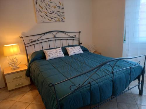 Postel nebo postele na pokoji v ubytování BILOCALE VIA CURZI centralissimo