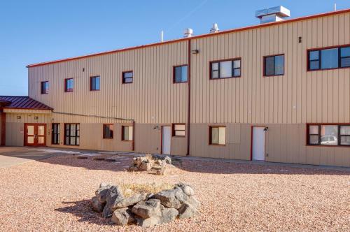 a large building with rocks in front of it at Del Norte Apartment with Loft Walk to Downtown! in Del Norte