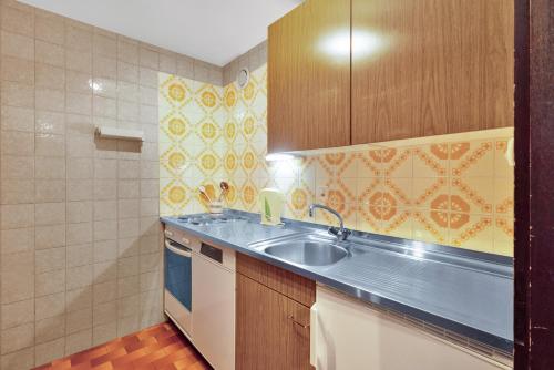 a kitchen with a sink and a counter top at Quille du Diable 34 - 4 pers - piscine in Nendaz