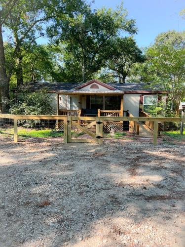 a house with a fence in front of it at Hidden Gem on the Tracks in Montgomery