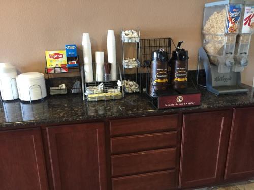 a counter with two bottles of beer on it at Super 8 by Wyndham Winnemucca NV in Winnemucca